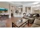 Bright living room with hardwood floors, comfortable seating, and an open concept design at 217 Lourdan Ct, Debary, FL 32713