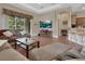 Spacious living room features wood floors, comfortable seating, and a bright, open layout at 217 Lourdan Ct, Debary, FL 32713