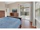 Spacious main bedroom with access to screened lanai at 217 Lourdan Ct, Debary, FL 32713