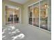 Spacious back patio featuring sliding glass doors to the interior rooms at 217 Lourdan Ct, Debary, FL 32713