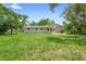 Expansive backyard with lush green grass, offering ample space for outdoor activities and potential for customization at 220 N Julia Ave, Deland, FL 32720