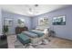 Cozy bedroom features calming colors, natural light, and minimalist decorations at 220 N Julia Ave, Deland, FL 32720