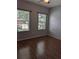 Hardwood floors, natural light and ceiling fan accent this bedroom at 223 W Fiesta Key Loop, Deland, FL 32720