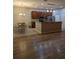 Beautiful kitchen open to the dining and living areas, featuring updated cabinets and stainless steel appliances at 223 W Fiesta Key Loop, Deland, FL 32720
