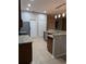 Functional kitchen offering stainless steel appliances, stone countertops, and generous cabinet space at 223 W Fiesta Key Loop, Deland, FL 32720