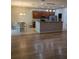 Eat-in kitchen with stainless steel appliances, granite counters, cherry cabinets, and tiled flooring at 223 W Fiesta Key Loop, Deland, FL 32720