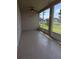 Spacious screened porch with views of backyard pond at 223 W Fiesta Key Loop, Deland, FL 32720