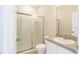 Well-lit bathroom featuring a shower with glass doors, vanity with sink, and toilet at 2241 Litchfield Loop, Deland, FL 32720