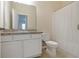 Well-maintained bathroom featuring a single vanity and shower/tub with white shower curtain at 2241 Litchfield Loop, Deland, FL 32720