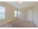 Bright bedroom featuring neutral walls, carpet flooring, and two windows for natural light at 2241 Litchfield Loop, Deland, FL 32720