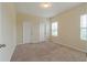 Comfortable bedroom with carpet floors, a window for natural light, and closet space at 2241 Litchfield Loop, Deland, FL 32720