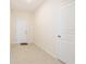 Bright foyer featuring tile flooring, neutral walls, and convenient access to other parts of the house at 2241 Litchfield Loop, Deland, FL 32720