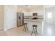 Modern kitchen with stainless steel appliances, granite countertops, and bar seating for casual dining at 2241 Litchfield Loop, Deland, FL 32720