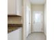 Bright kitchen area with granite countertops, and tile flooring at 2241 Litchfield Loop, Deland, FL 32720