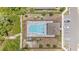 Aerial view of a community pool with lounge chairs and parking at 2241 Litchfield Loop, Deland, FL 32720