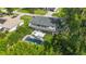 Charming two-story home featuring a balcony, backyard patio and a refreshing swimming pool at 2250 Davis Dr, New Smyrna Beach, FL 32168