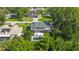 Beautiful two-story home with a swimming pool and spacious yard surrounded by lush greenery at 2250 Davis Dr, New Smyrna Beach, FL 32168