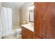 Bathroom featuring a shower with curtain and a wooden vanity with storage at 2250 Davis Dr, New Smyrna Beach, FL 32168
