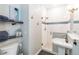 Modern bathroom featuring walk-in shower with glass door, floating shelves and vessel sink at 2250 Davis Dr, New Smyrna Beach, FL 32168