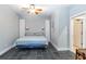 Charming bedroom with tile floors, a cozy bed, and minimalist décor with storage units at 2250 Davis Dr, New Smyrna Beach, FL 32168