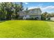 Charming two-story home with a well-maintained front lawn and inviting entrance steps at 2250 Davis Dr, New Smyrna Beach, FL 32168