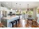 Modern kitchen and dining area boasting stainless steel appliances, an island, and counter seating at 2250 Davis Dr, New Smyrna Beach, FL 32168