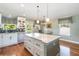 Stylish kitchen with granite countertops, island, and stainless steel appliances at 2250 Davis Dr, New Smyrna Beach, FL 32168
