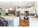 Eat-in kitchen featuring hardwood floors, stainless steel appliances, and a large island at 2250 Davis Dr, New Smyrna Beach, FL 32168