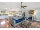 Inviting living room featuring hardwood floors, ceiling fan, and access to the eat-in kitchen at 2250 Davis Dr, New Smyrna Beach, FL 32168