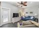 Inviting living room with a blue sofa, stylish furniture, and access to the outdoor area at 2250 Davis Dr, New Smyrna Beach, FL 32168