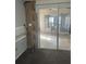 A tiled sunroom is visible from this carpeted room through a sliding glass door at 2366 Florida Dr, Deltona, FL 32738