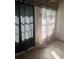 Light shines on sheer curtains covering a window and on the dark curtain next to it at 2366 Florida Dr, Deltona, FL 32738