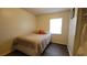 Bright bedroom featuring a comfortable bed, a window for natural light, and sleek flooring at 2380 Spring Hollow Drive, Orange City, FL 32763