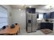 Modern kitchen featuring stainless steel appliances, updated cabinetry, and a marble tile floor at 2380 Spring Hollow Drive, Orange City, FL 32763
