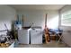 Spacious laundry room featuring washer and dryer, water heater and storage area at 2380 Spring Hollow Drive, Orange City, FL 32763