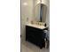 Bathroom vanity featuring dark cabinets, a white countertop, a gold-trimmed mirror, and gold faucet at 2380 Spring Hollow Drive, Orange City, FL 32763