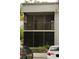 Condo building featuring a screened balcony, providing a relaxing outdoor space at 2565 Oak Park Way # 213, Orlando, FL 32822