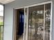 Balcony with sliding glass door entry, overlooking the parking lot at 2565 Oak Park Way # 213, Orlando, FL 32822