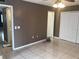 Spacious bedroom with tile floors, ceiling fan, closet and ensuite bath at 2565 Oak Park Way # 213, Orlando, FL 32822