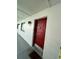 Exterior view of the red-painted front door with door number 2565 at 2565 Oak Park Way # 213, Orlando, FL 32822