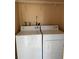 Laundry room with modern, white washer and dryer at 2565 Oak Park Way # 213, Orlando, FL 32822