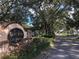 Lake View on Lake Fredrica sign, surrounded by lush landscaping and a tree-lined street at 2565 Oak Park Way # 213, Orlando, FL 32822