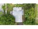 Aerial view of a well maintained house showcasing its roof and surrounding lush landscaping at 2708 Smithfield Dr, Orlando, FL 32837