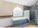 Bathroom with a tub, shower, window, and tile at 2708 Smithfield Dr, Orlando, FL 32837