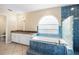 Bathroom with a tub, shower, window, and tile at 2708 Smithfield Dr, Orlando, FL 32837