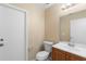 Neutral bathroom featuring a vanity, a toilet, and a large mirror at 2708 Smithfield Dr, Orlando, FL 32837