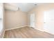 Neutral bedroom featuring laminate flooring, a closet, and ample natural light at 2708 Smithfield Dr, Orlando, FL 32837