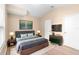Modern bedroom with neutral tones, artwork, stylish furniture, and ample lighting at 2708 Smithfield Dr, Orlando, FL 32837