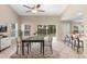 Dining area with a modern table, seating for six, and a view of the backyard at 2708 Smithfield Dr, Orlando, FL 32837
