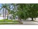 Charming single-story home with lush front yard, mature trees, and an inviting brick pathway to the front door at 2708 Smithfield Dr, Orlando, FL 32837
